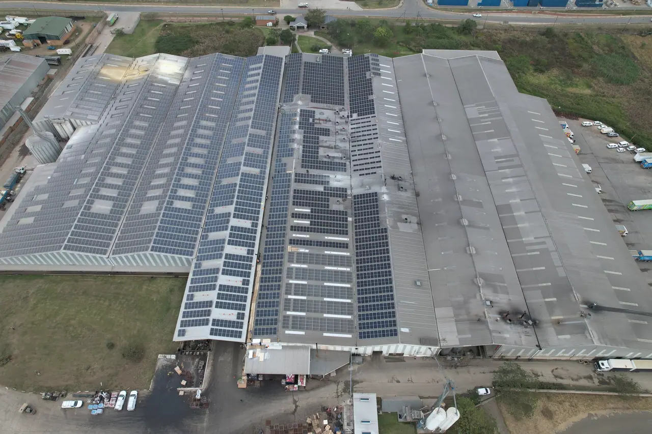 Aerial view of the Truda Foods plant in Pietermaritzburg, rows of solar modules along its long factory roofs