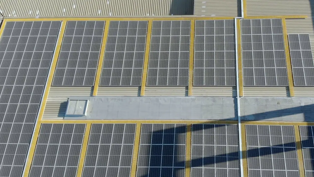Rows of solar modules on the Ballito Lifestyle Centre roof, seen from above, with yellow walkway lines between them